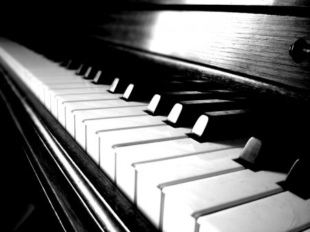 view down a piano keyboard. black and white photo