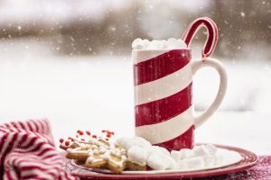red and white striped mug on cookie plate